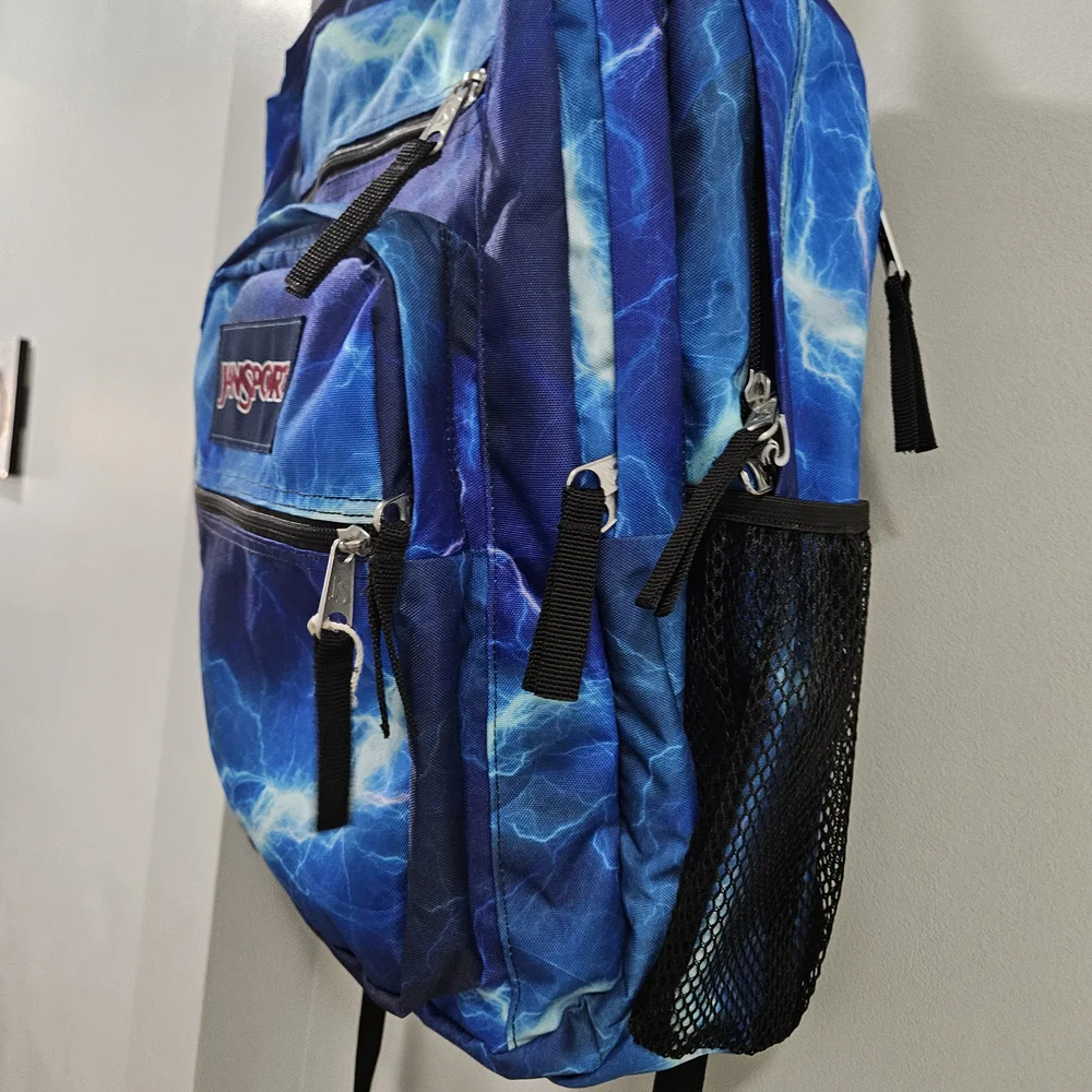 JanSport Blue Backpack with Dynamic Pattern - Picture 4 of 8